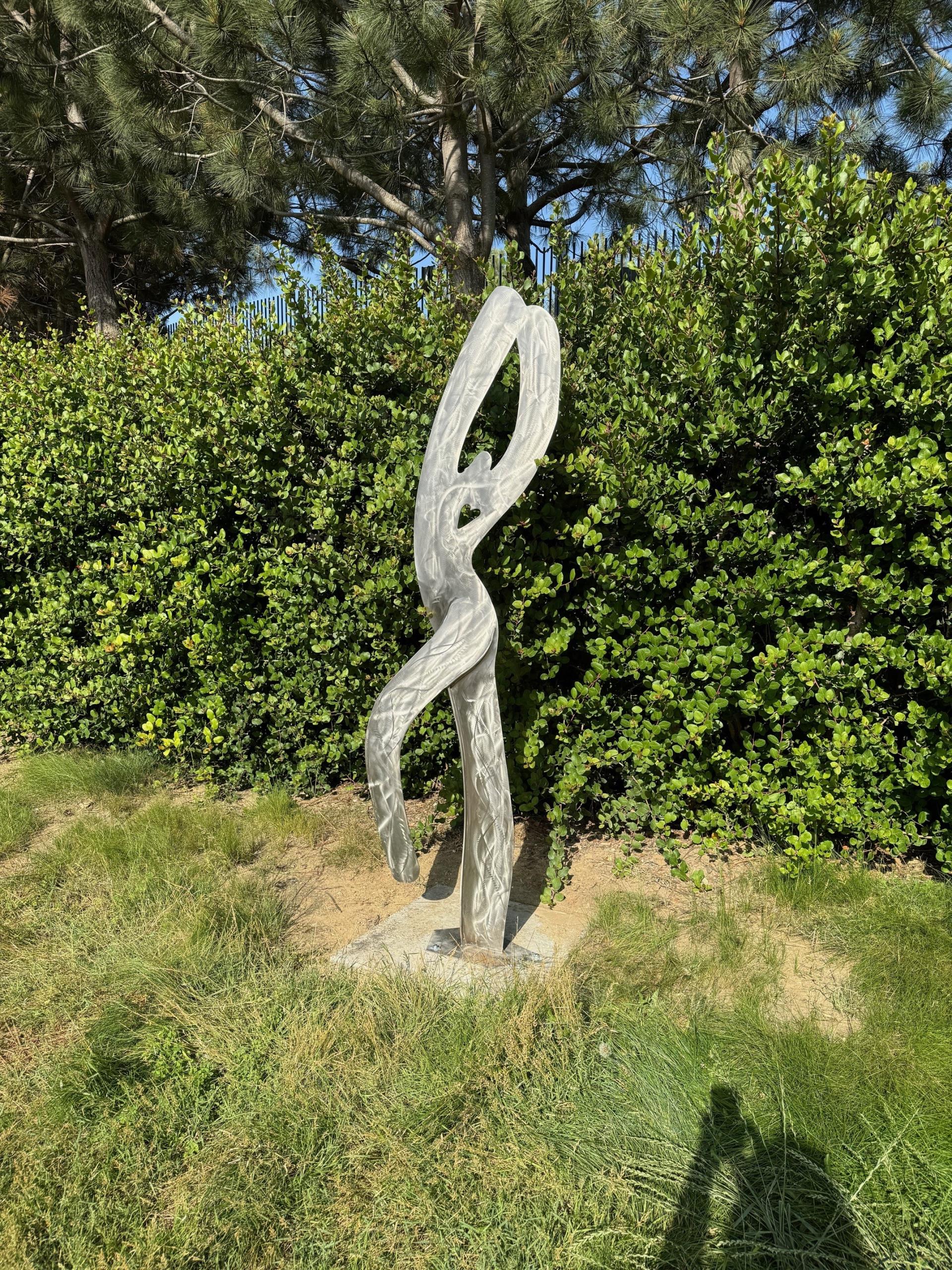 Sculpture of a figure in a playful stance - sculpture in Civic Center Park