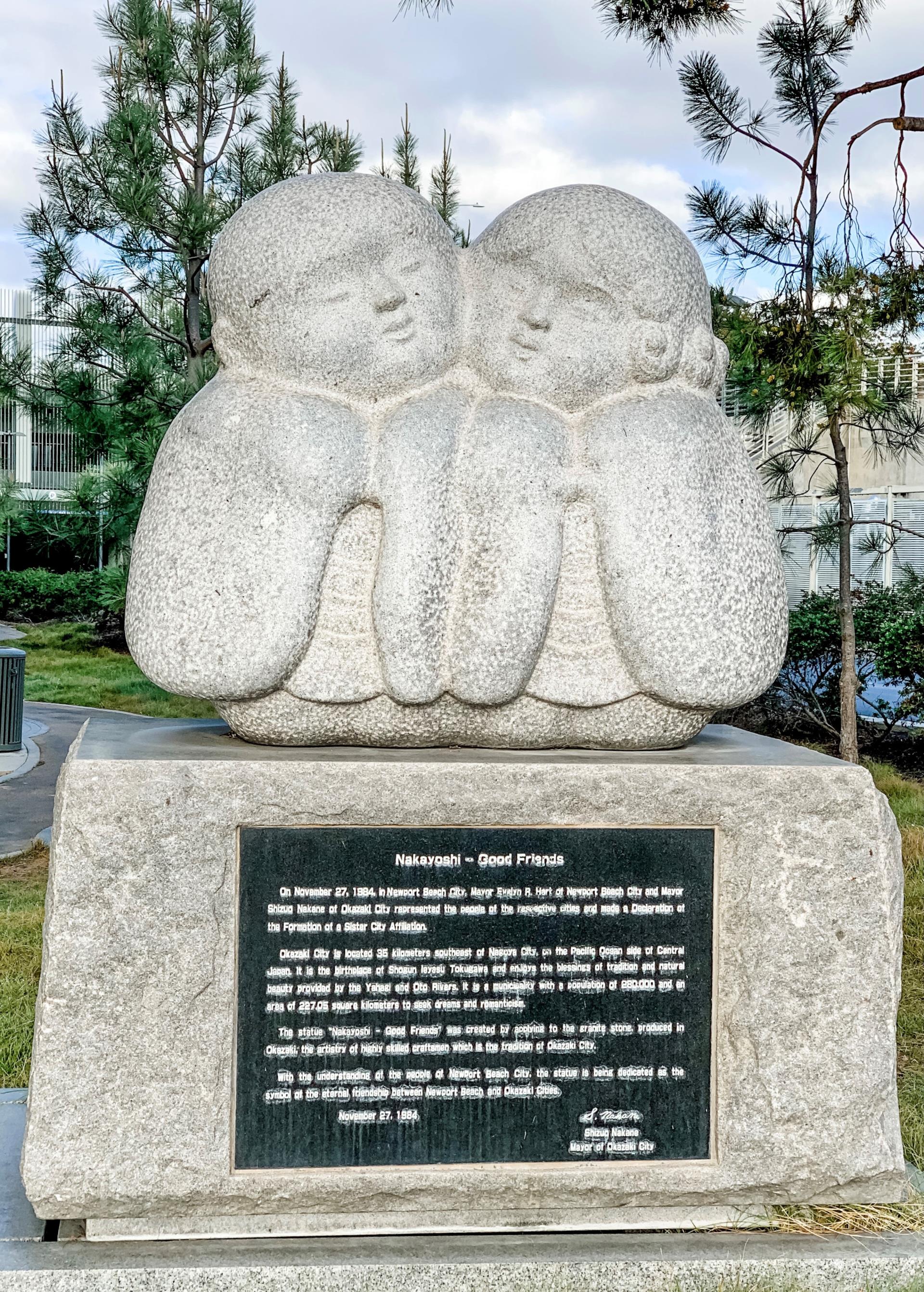 Statue of two children tenderly standing next to each other. A gift from the City of Okazaki